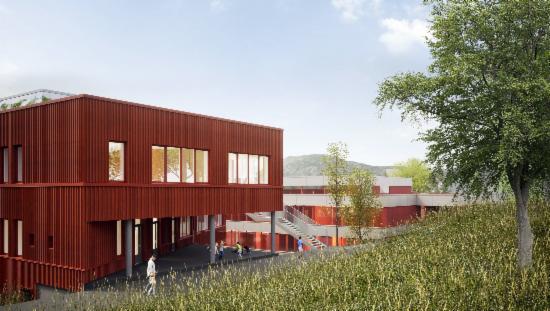 Illustrasjonen viser tilbygget som skal komme på Haukeland skole og hovedbygget i bakgrunnen.